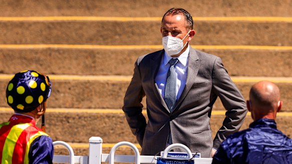 Chris Waller talks to jockeys James McDonald and Glen Boss.