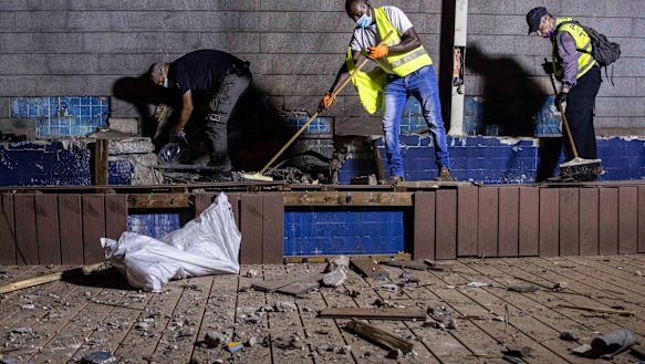 Israeli police inspect the damage at the site hit by a rocket fired by Palestinian militants from the Gaza Strip in the southern city of Ashdod, Israel.