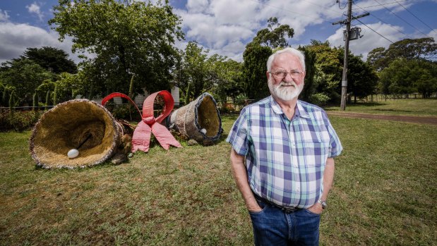 Colin Huf with his hay bale art.