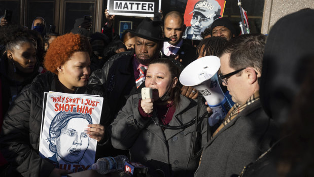 Katie Bryant, Daunte Wright’s mother, centre, speaks alongside attorney Jeff Storms outside the courtroom in Minneapolis. 