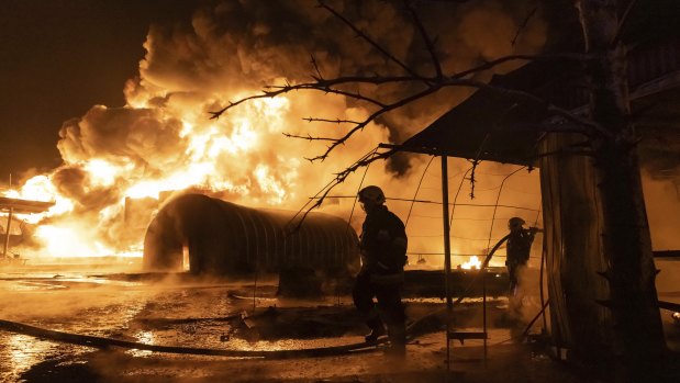 Firefighters put out a blaze at a petrol station after a Russian attack in Kharkiv, Ukraine, on Saturday.