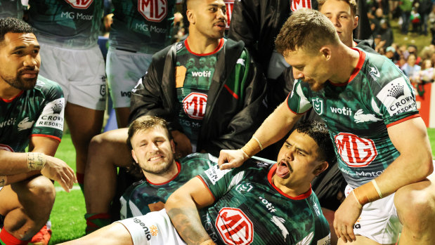 Latrell Mitchell and South Sydney Rabbitohs players celebrate their win over the Wests Tigers.