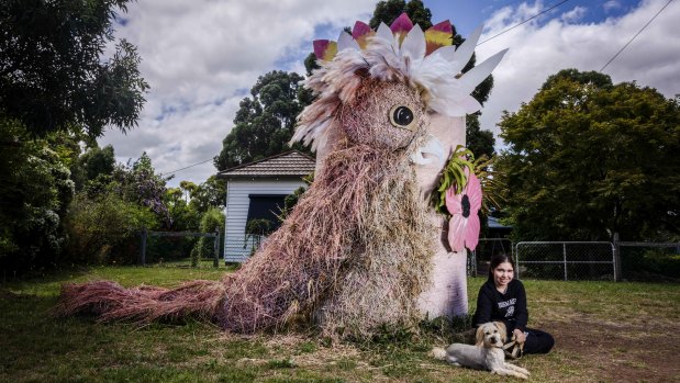 Brooke Taylor, 17, with Demi the family dog. The Taylors created a galah.