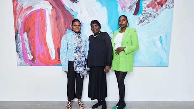 From left, Sally Gabori’s great-granddaughter Tori Juwarnda Wilson-Gabori, daughter Amanda Gabori Dibirdibi and great-granddaughter Narelle Gabori at the Fondation Cartier exhibition in Paris.