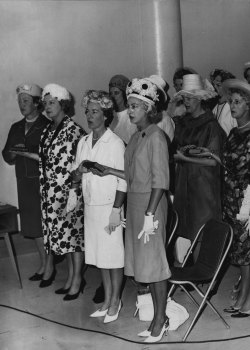 “56 women police, who until yesterday were designated special police took the oath as full members of the force. March 19, 1965.” June Kelly in front row, right.