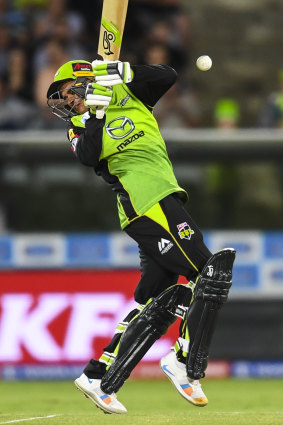 Evasive: Usman Khawaja struggles to cope with a high-pitched delivery.
