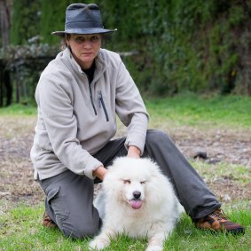 Tania Shaw and her dog, Diva, found the semi-submerged ute. Her neighbour's body was later found beneath it.
