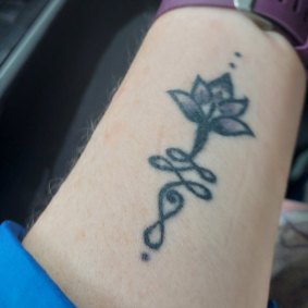 Sue Williams lotus flower tattoo is a symbol of resilience.  