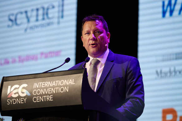 Planning and Public Spaces Minister Paul Scully speaks at the Sydney Summit at Darling Harbour on Tuesday.