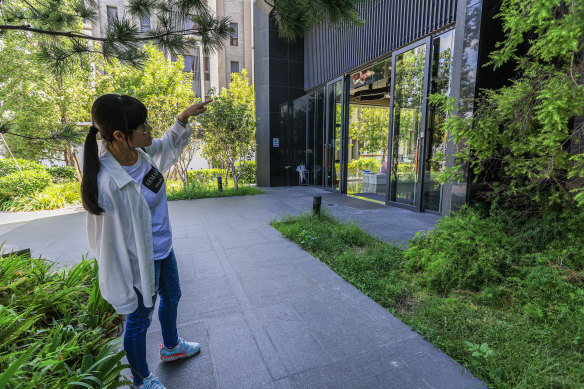 A neighbour surveys the scene where Lai’s body was discovered. 