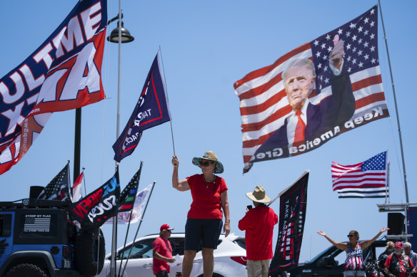 Supporters of former President Donald Trump gather outside Mar-A-Lago