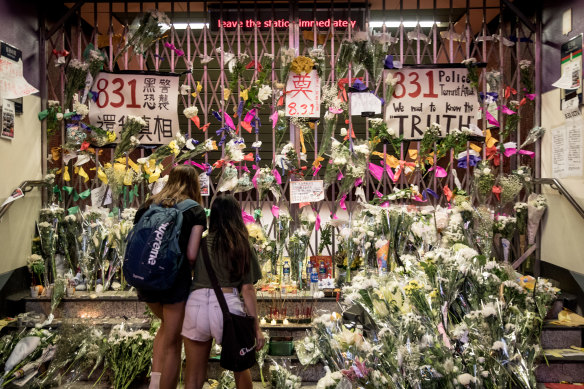 People lay flowers at a tribute wall at the entrance to Prince Edward MTR station, where some believe protesters were killed. Police and medical authorities have denied the rumours.
