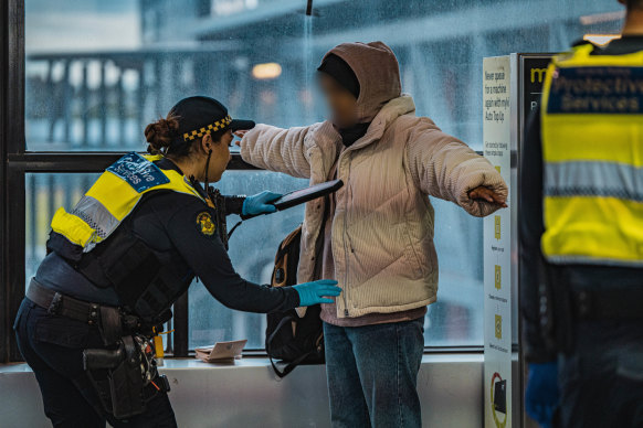 Officer from Victoria Police’s Operation Alliance search people for weapons.