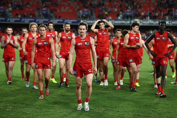 Gold Coast skipper Noah ANderson leads his team off the ground after another frustrating loss.