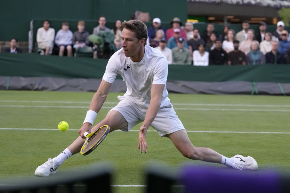 Belgium’s Kimmer Coppejans returns to Australia’s Alex de Minaur.