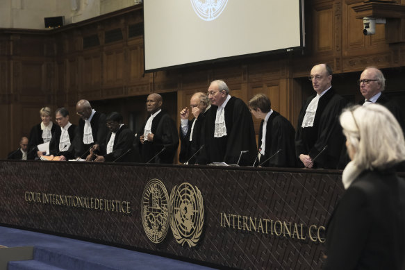 Judges Israel’s Aharon Barak, centre right, and South Africa’s Dikgang Ernest Moseneke, centre left, preside over the opening of the hearings at the International Court of Justice.