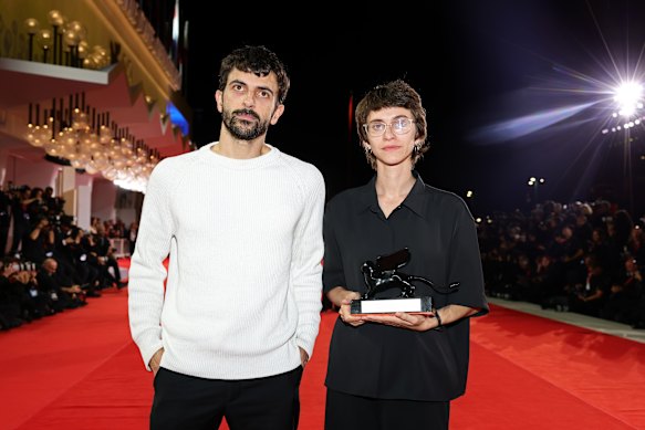 Israeli directors Yuval Abraham and Rachel Szor with the special jury prize award they won for NAZA at the Venice Film Festival.