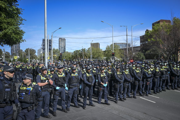 Dozens of police officers near Clarendon Street in Southbank  on Thursday.