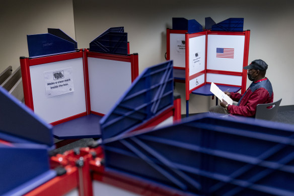 Cornelius Whiting fills out his ballot at an early voting location in Alexandria, Virginia.