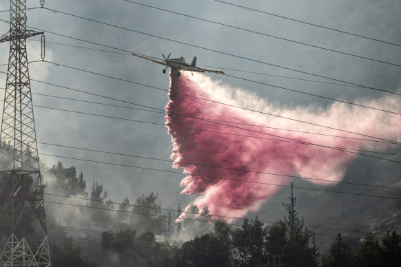 Israeli firefighters extinguish blazes in northern Israel caused by Hezbollah rockets in July. 