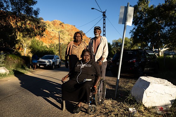 Grandparents Peggy Granites (rear left), Robin Granites (right), and Karen White wait for missing five-year-old Sharon Granites outside her home at the Old Timers Camp in Alice Springs, Northern Territory.
