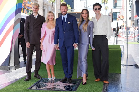 The Beckham family: (from left) Romeo Beckham, Harper Seven Beckham, David Beckham, Victoria Beckham, and Cruz Beckham pose with David Beckham’s new star during at the Hollywood Walk of Fame on Friday. Brooklyn and wife Nicola are notably absent.