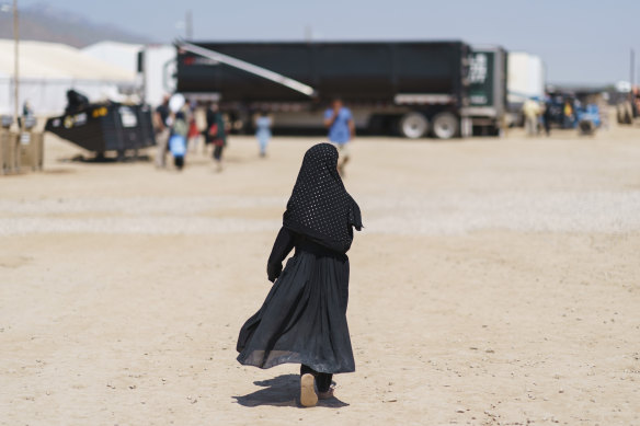 A child walks through Fort Bliss, New Mexico, where Afghans evacuated from Kabul are being housed. 