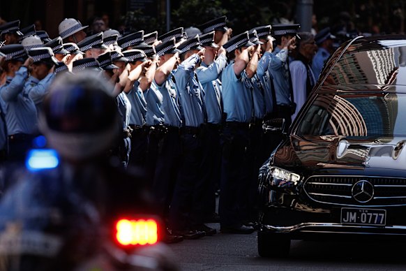 Officers form a guard of honour.
