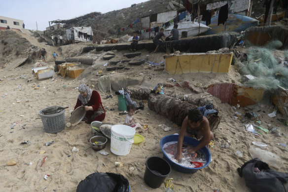 Palestinians resort to the sea water to bathe and clean their tools and clothes due the continuing water shortage in the Gaza Strip.