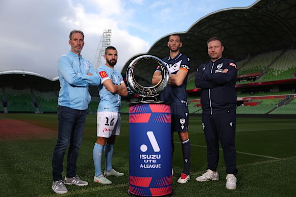 Melbourne City coach Aurelio Vidmar (left), Behich, Melbourne Victory captain Roderick Miranda and coach Arthur Diles with the A-League trophy.