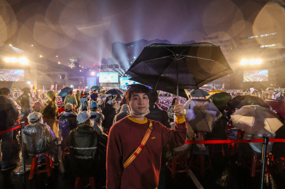 Young KMT supporter Gus Chen at a KMT rally. 