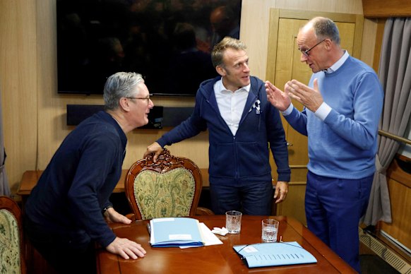 UK Prime Minister Keir Starmer, French President Emmanuel Macron and German Chancellor Friedrich Merz on a train to Kyiv last week. A tissue is on the table.