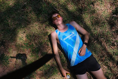 Time for an ice bath: Rohan Martin Ritchie lies down after finishing his 100km run.