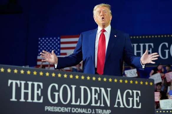 President Donald Trump at a rally in Michigan to mark his first 100 days in office.
