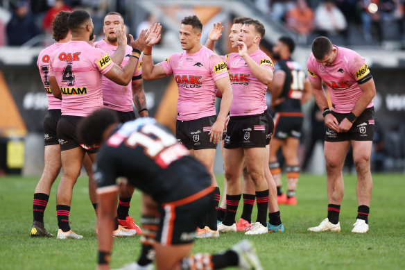 An Origin-depleted Panthers side celebrate their narrow win over Wests Tigers on Sunday.