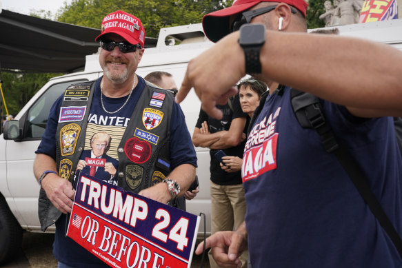 Supporters of former president Donald Trump gather near the E. Barrett Prettyman US Federal Courthouse.