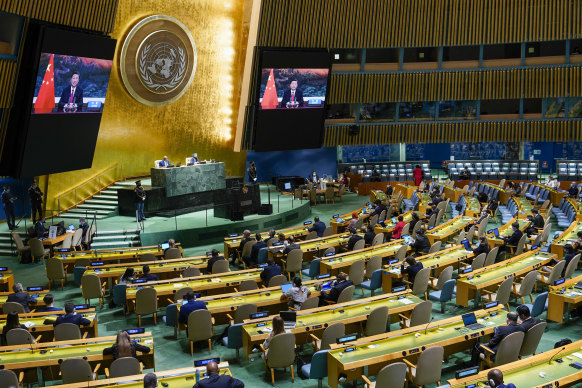 Chinese President Xi Jinping is seen on a video screen at the UN in September. 