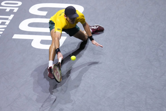 Alex de Minaur stretches to return the ball against Finland’s Emil Ruusuvuori.