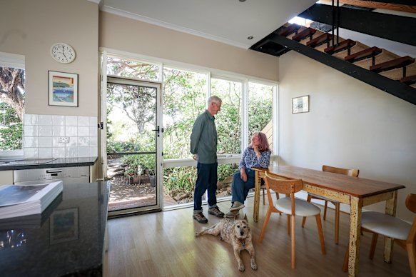 Gary Hardy and Anne Casey-Hardy, with Ozzie the dog, are selling their home.