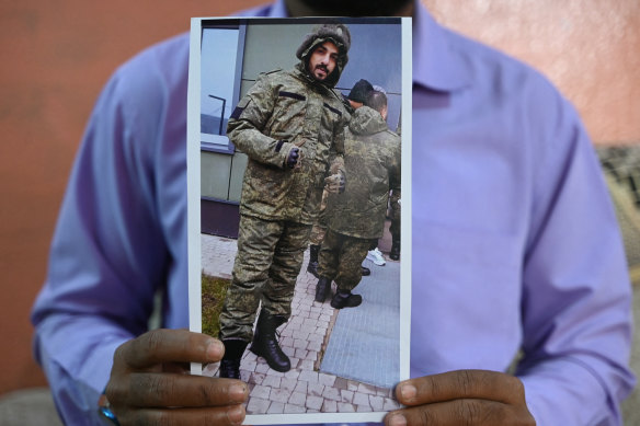 Mohammed Imran holds a picture of his brother Indian national Mohammed Asfan who last called family from the Russian city of Rostov-on-Don before being deployed to fight for Russia in Ukraine.