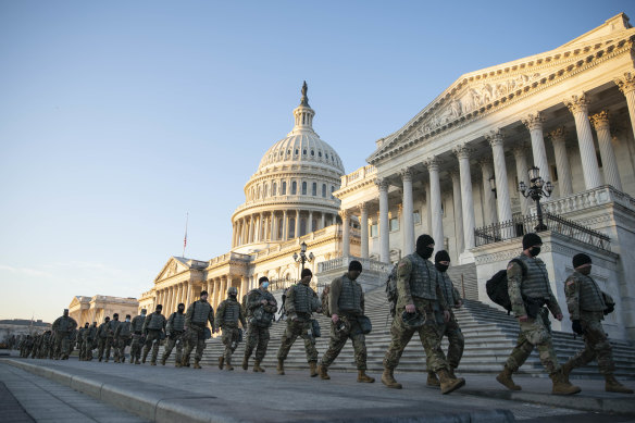 Members of the National Guard outside of the US Capitol as the House prepares to vote. 