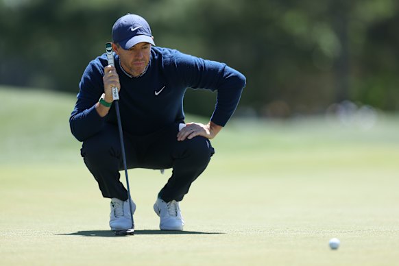 Rory McIlroy lining up a putt on the eighth green during his first round at the 2026 Masters.