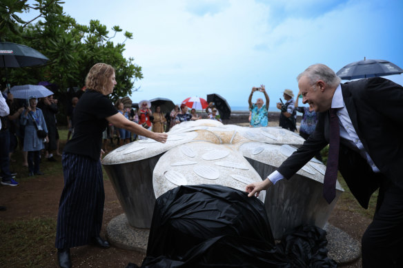 Prime Minister Anthony Albanese helps unveil artist Techy Masero’s Cyclone Tracy memorial – Five Decades, Five Flowers, Forever Remembered –  in Darwin on Christmas Day.