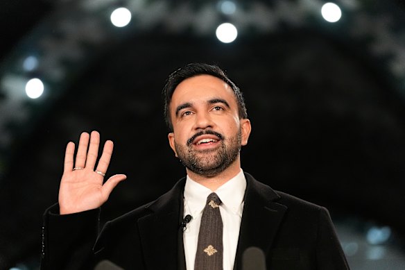 Mayor-elect Zohran Mamdani takes the oath of office during a swearing-in ceremony in the Old City Hall subway station.