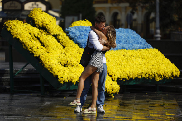 A couple embraces in Lviv as Ukraine prepares to celebrate its Independence Day.