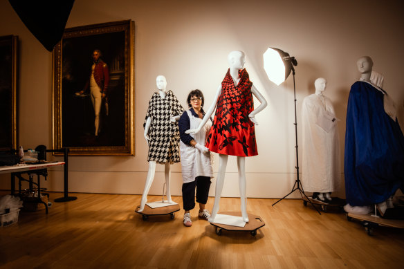 Conservator Viki Car with two pieces from Alexander McQueen’s Horn of Plenty that feature in the NGV exhibition.