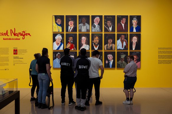 Gallery visitors view the artwork by Vincent Namatjira at the National Gallery on Friday. 