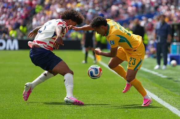Australia’s Nishan Velupillay duels with Chris Richards, of the USA.