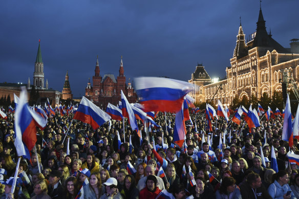 People gather at a concert to celebrate the incorporation of regions of Ukraine to join Russia, at the Red Square in Moscow on Friday.