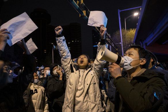 Protesters shout slogans against Chinas strict zero COVID measures in Beijing.